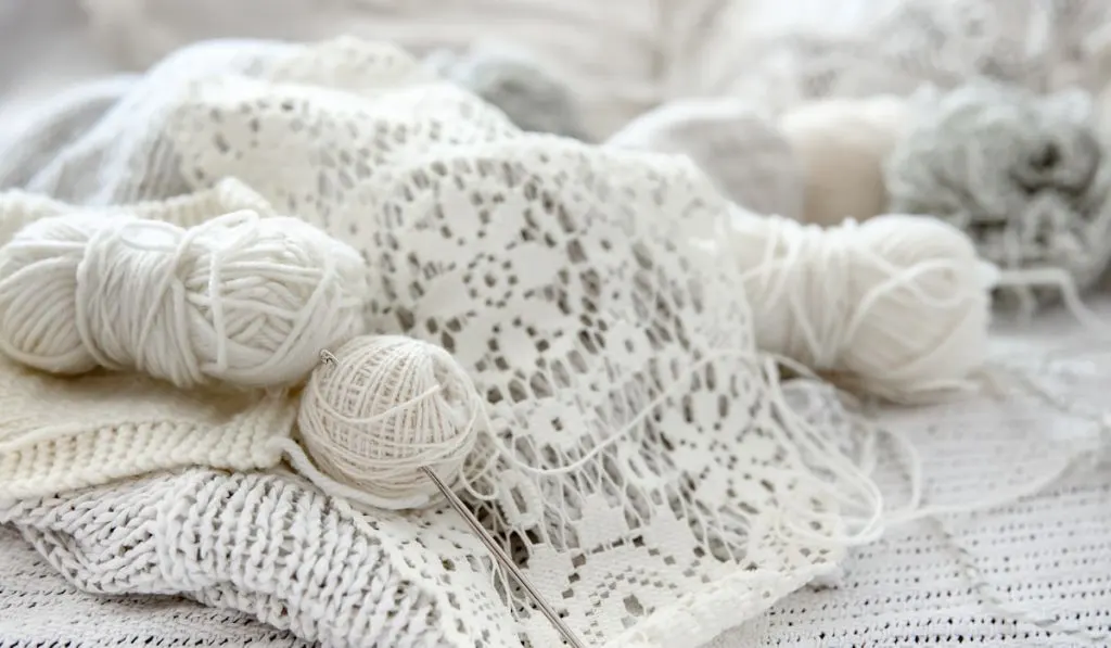 Close-up of crochet threads and handmade products.