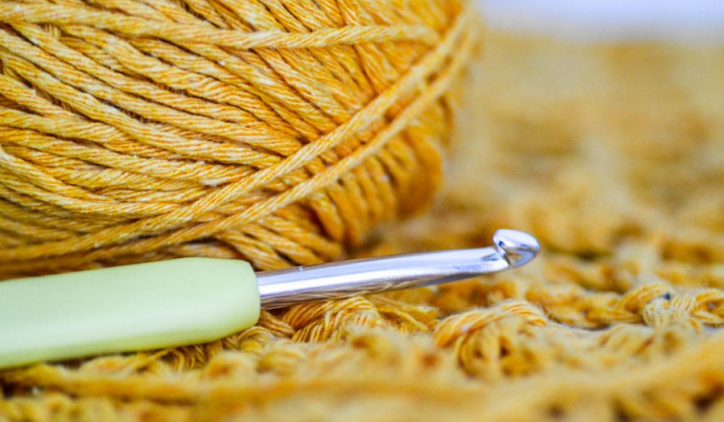 closeup of ergonomic hook on yarn