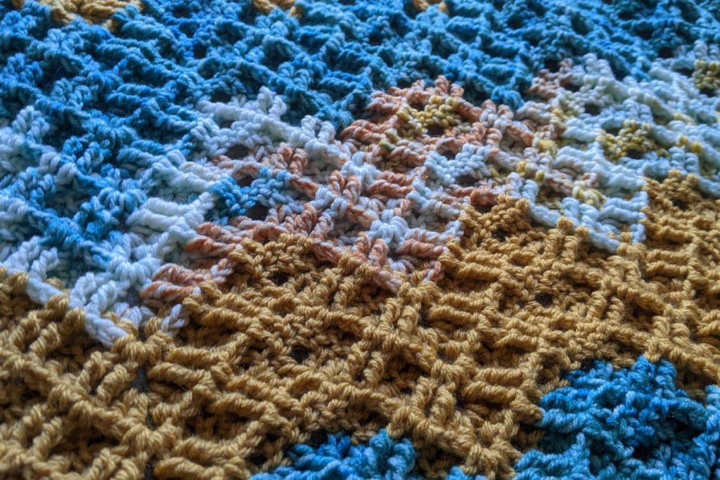 Closeup of the blanket texture  created when following the double triple ripple crochet pattern 