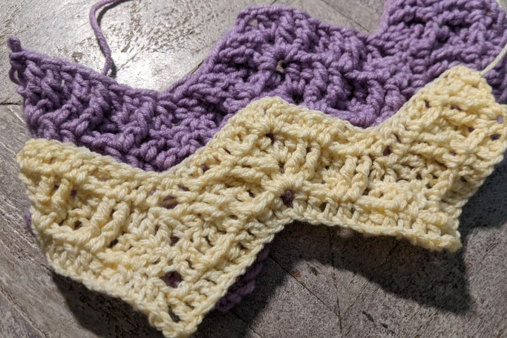 Two swatches of the textured ripple crochet pattern. The top swatch is in worsted weight yarn and shows a more defined texture. The bottom swatch is in a #3 light weight yarn and shows a less defined texture.