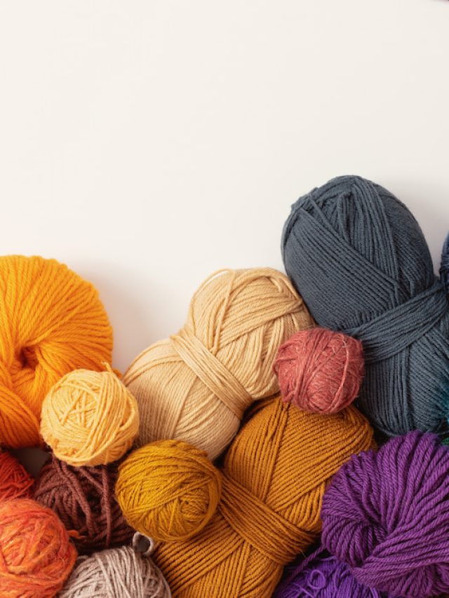 multicolored yarn balls on a white background