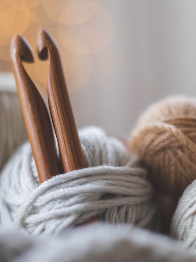 pair of crochet hooks attached to yarn balls