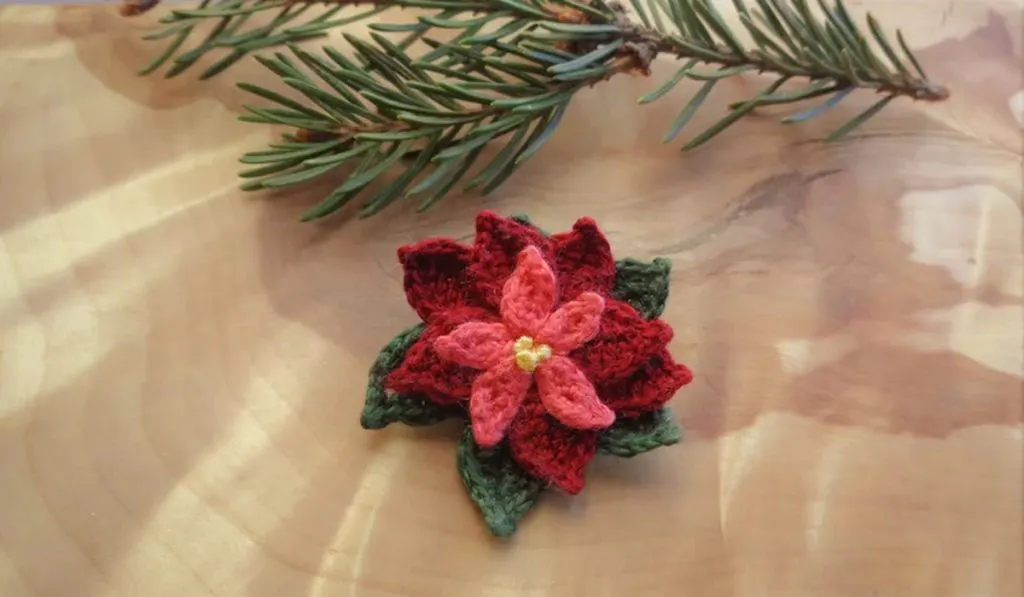 Crochet Poinsettia Brooch pattern by AniAmiCrochet