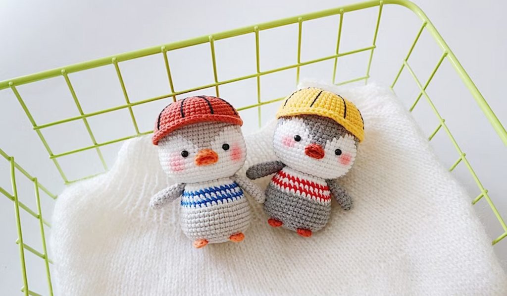 Little Penguin Amigurumi Crochet Pattern by BearybearnitaDesign in a basket
