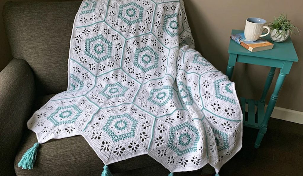 Succulent Spring Hexagon Afghan Crochet Pattern on a sofa at home
