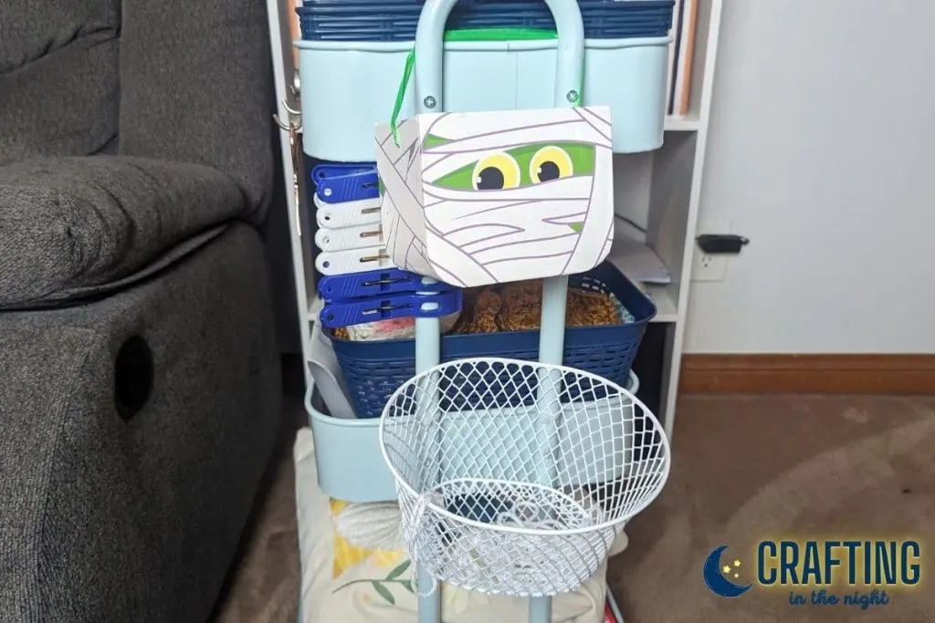 trash cans for yarn clippings on the crochet craft cart