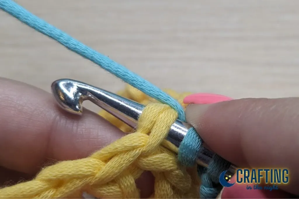Step 3. Inserting the hook into the yellow stitch