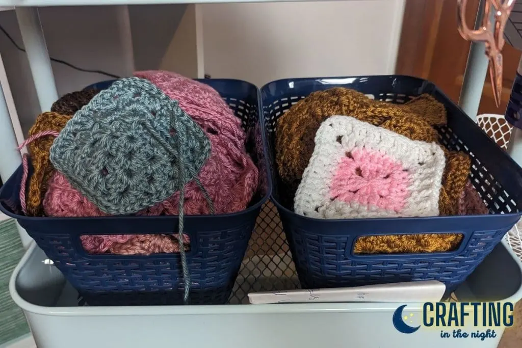 plastic bins for granny squares in the crochet craft cart