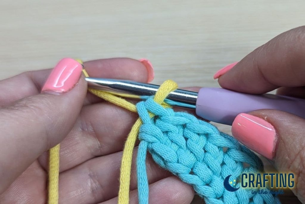 Step 1: Work the last stitch until you have two loops on your hook.Step 2: Drop the old color and pick up the new color.Step 3: Yarn over with the new color and pull through both loops on your hook to complete the stitch.