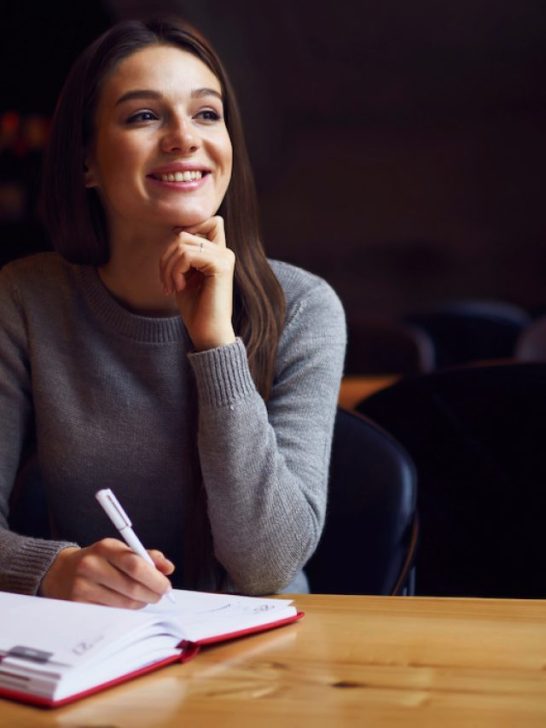 girl thinking of what to write in her journal