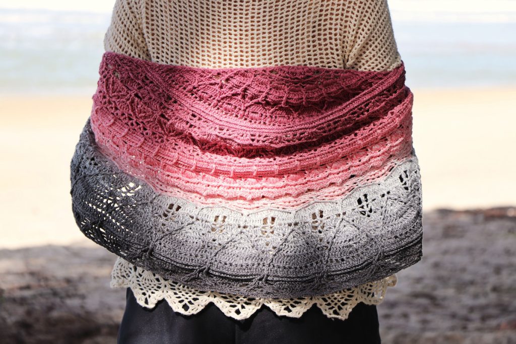 Handmade crochet shawl on blur background 