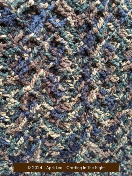 closeup of a textured crochet blanket using the double triple ripple stitch