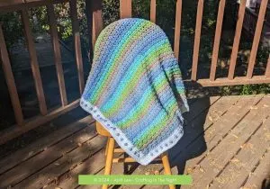 Diamond Weave Blanket over a chair on a deck